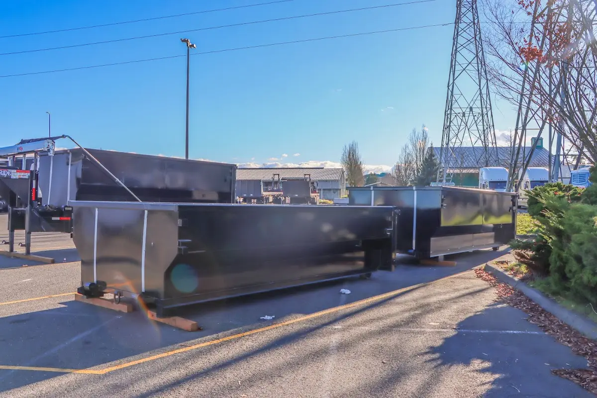 Roll-off dumpster ready for waste disposal at job site for Concrete Dumpster Rental in Franklin